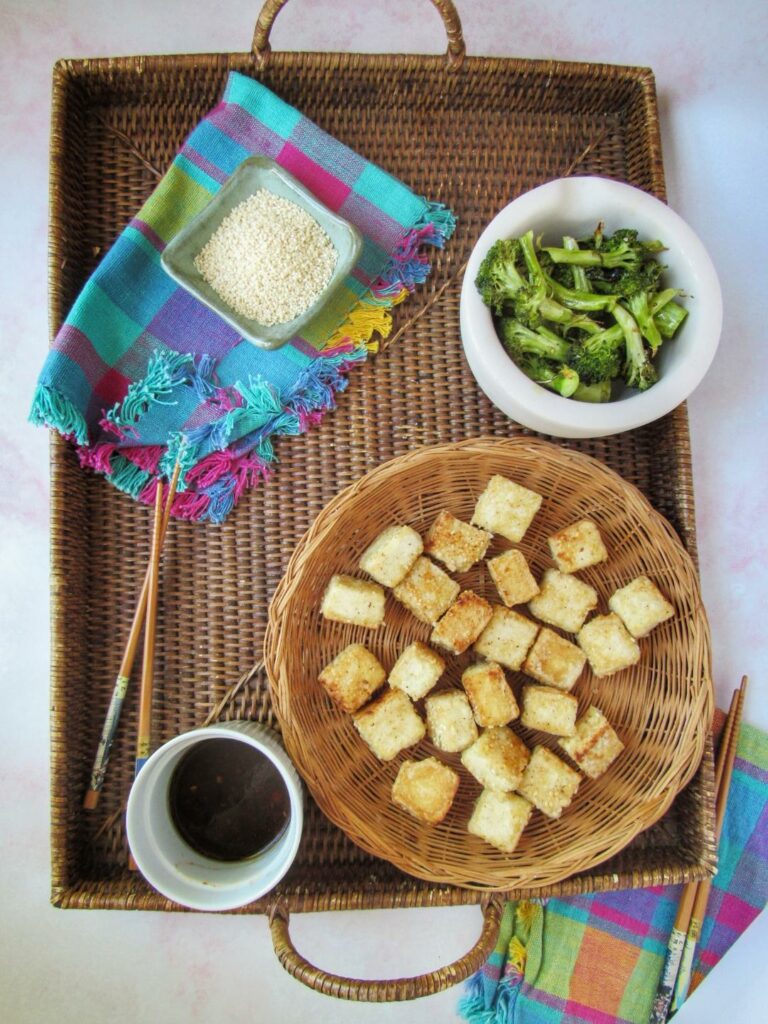 crispy tofu bites with tangy sauce, and a side of broccoli