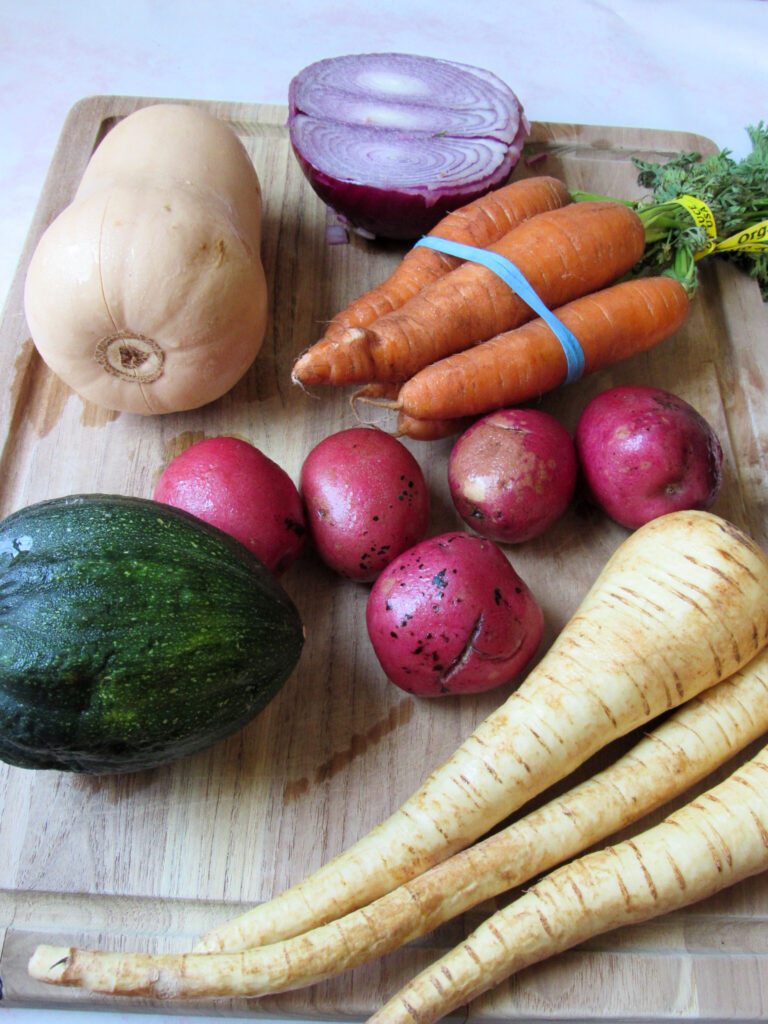 A spread of root vegetables on a cutting board