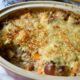 A casserole of vegetables topped with crispy cheese and panko