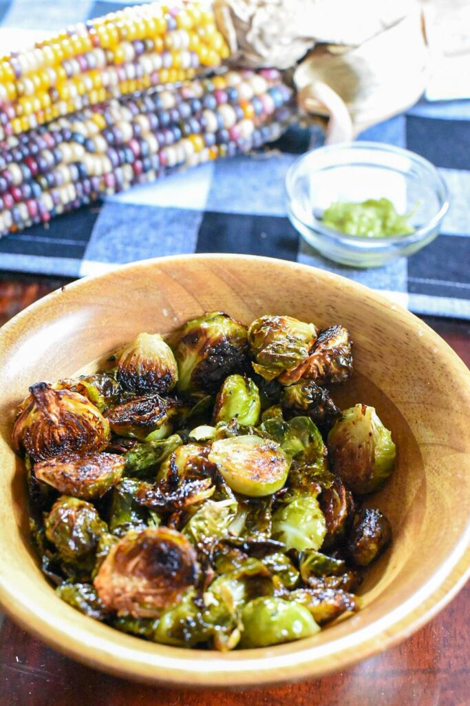 wasabi brussels sprouts in a wooden bowl