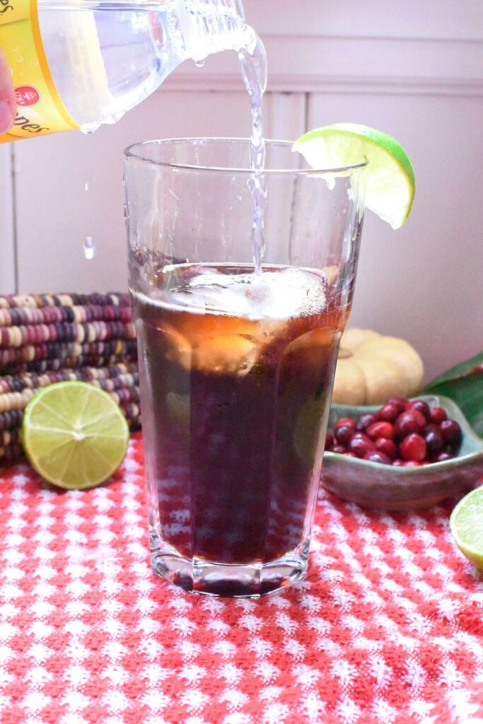 pouring tonic into a coffee tonic
