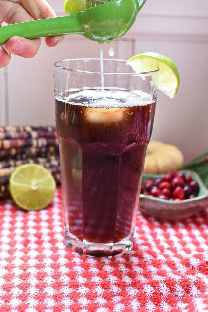 squeezing lime into a cold brew coffee tonic recipe