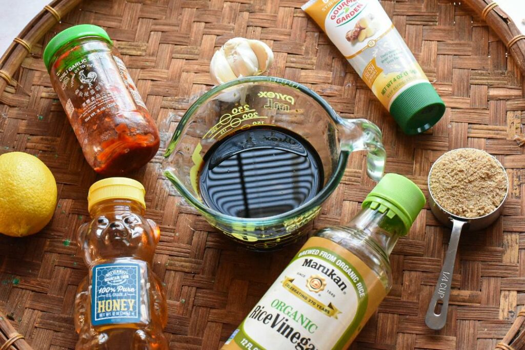 The ingredients to make sweet and spicy asian sauce for korean fried chicken breasts