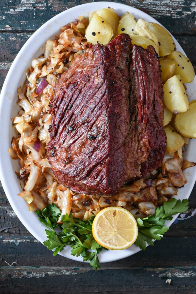 overhead shot of crispy corned beef and lemon garlic cabbage with potatoes.