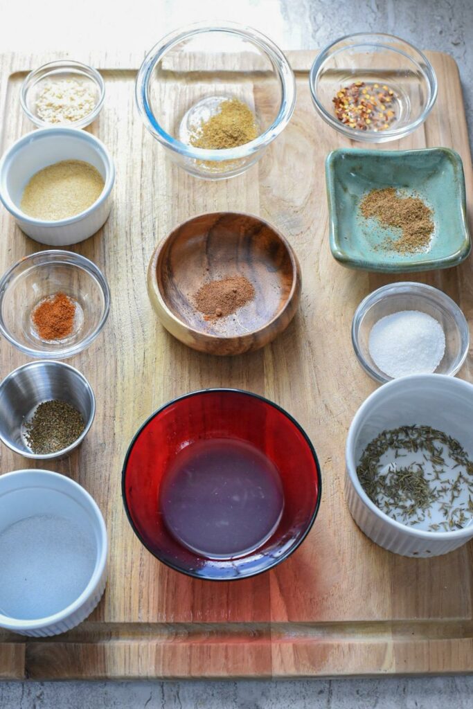 Spices in separate bowls for jerk turkey marinade