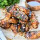 A pile of chipotle ginger orange grilled chicken wings