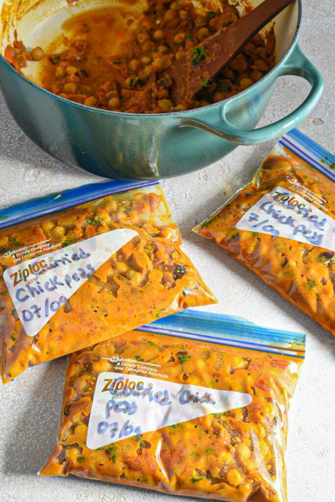 Plastic ziplock bags filled with freezable coconut chickpea curry.
