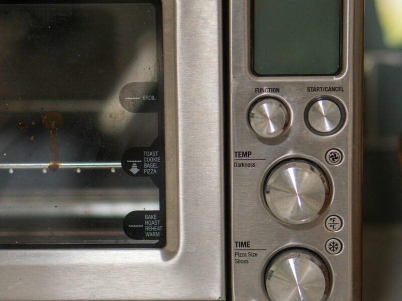 a photo of the electronic panels of a toaster oven on a counter