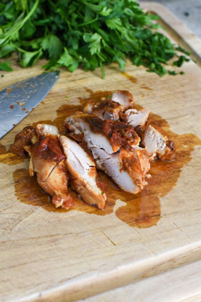 Slow cooked chicken thighs sliced into strips for chicken thigh fajitas