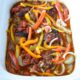 A white crockpot filled with healthy chicken fajitas recipe