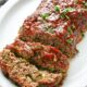 A loaf of healthy meatloaf cut into two pieces