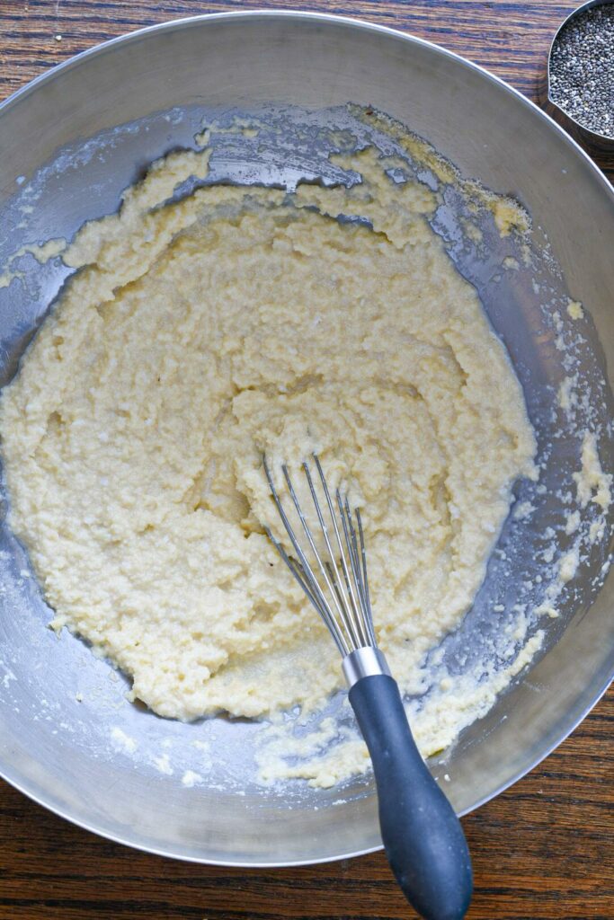A stainless steel bowl filled with almond flour banana pancakes batter