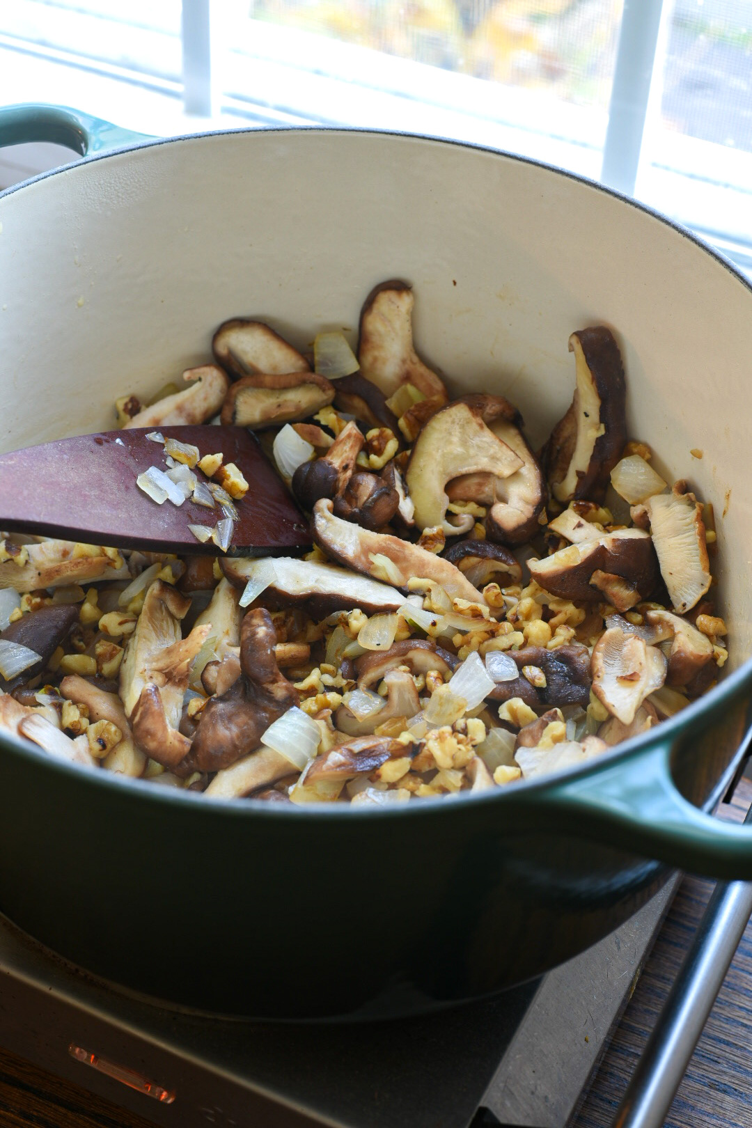 barley salad recipe with walnuts A dutch oven filled with sauteeing shiitake mushrooms and onions