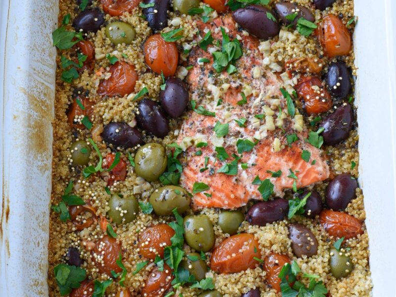 slow cooker salmon and quinoa An overhead shot of slow cooker salmon in a crockpot with olives, tomatoes and quinoa
