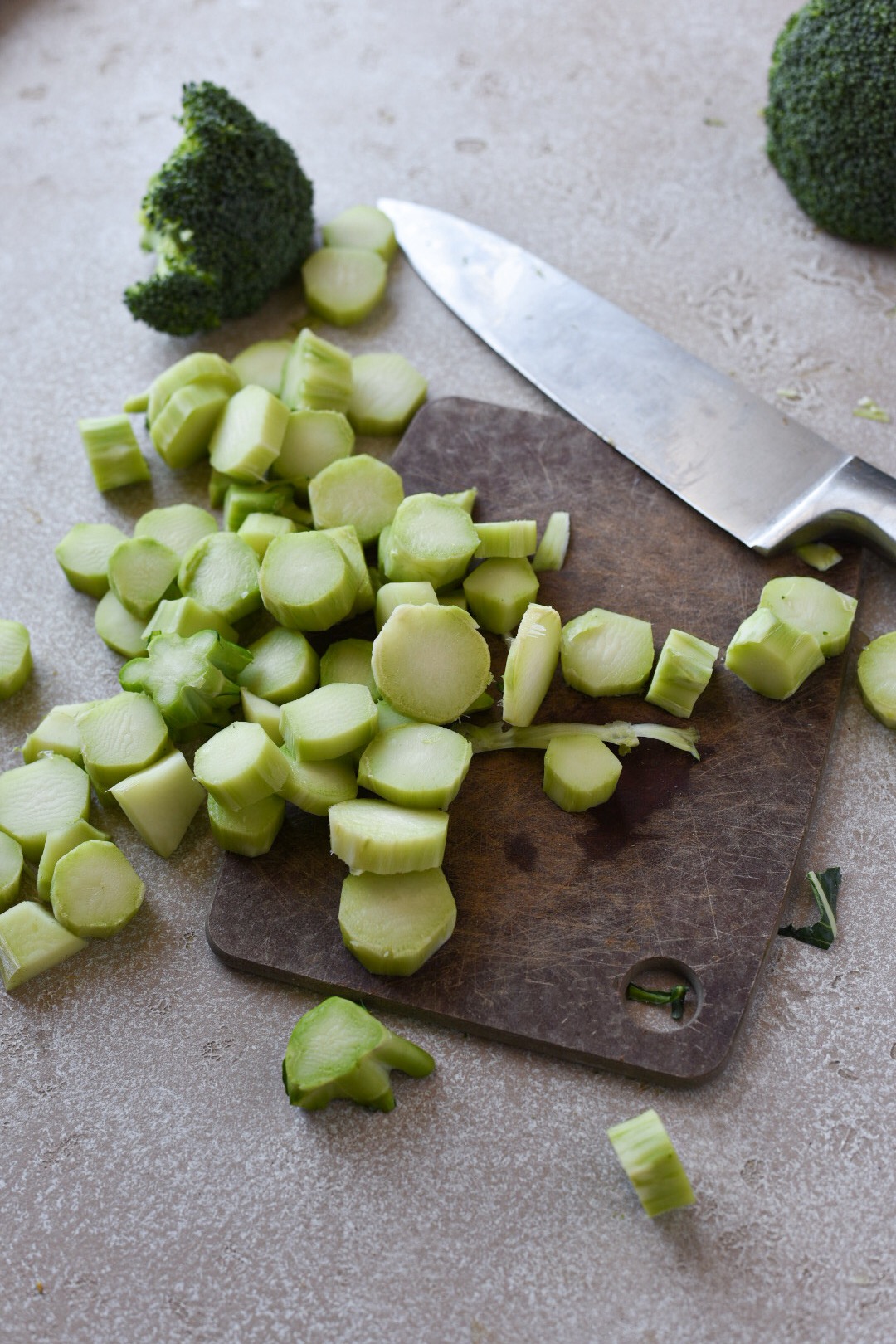 what to do with broccoli stems broccoli stem medallions chopped on a cutting board with a knife