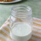 homemade ranch dressing with greek yogurt in a glass on a stripped towel