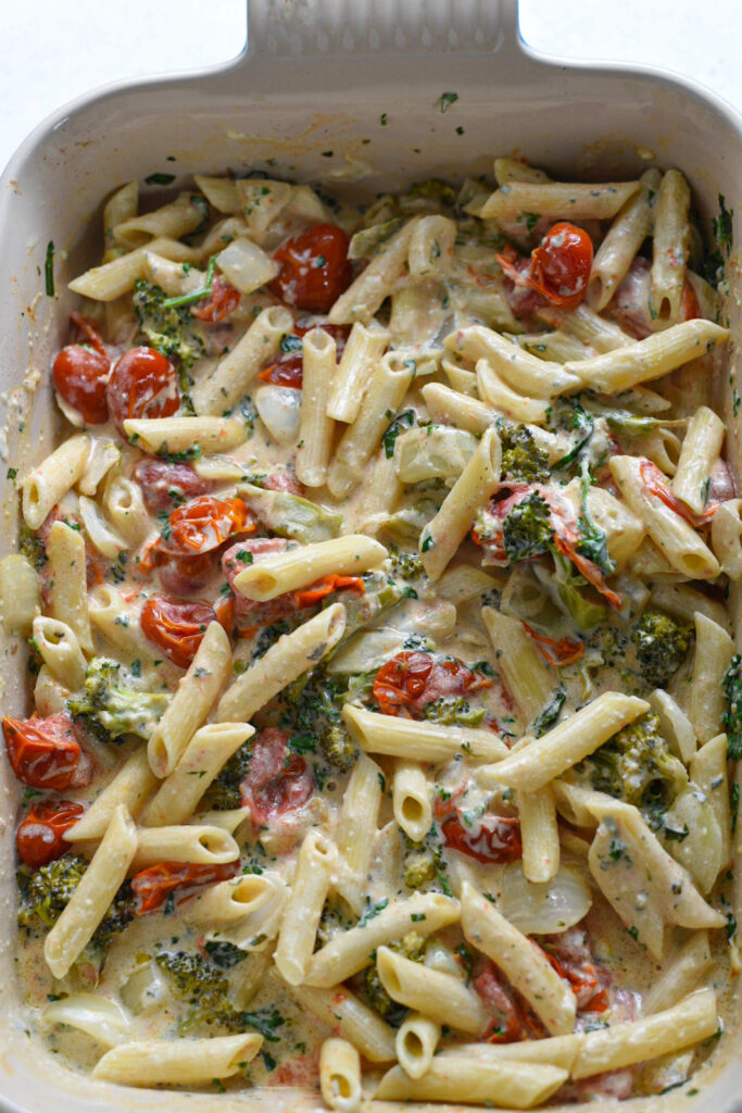 pasta with boursin cheese A boursin cheese pasta recipe in a baking dish with pasta, tomatoes, and broccoli.