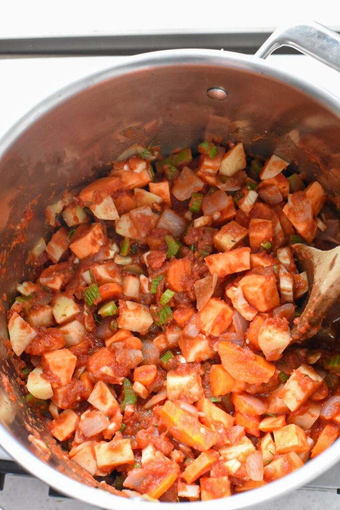 sardinian soup Potatoes mixed into tomato sauce and veggies in a stock pot.