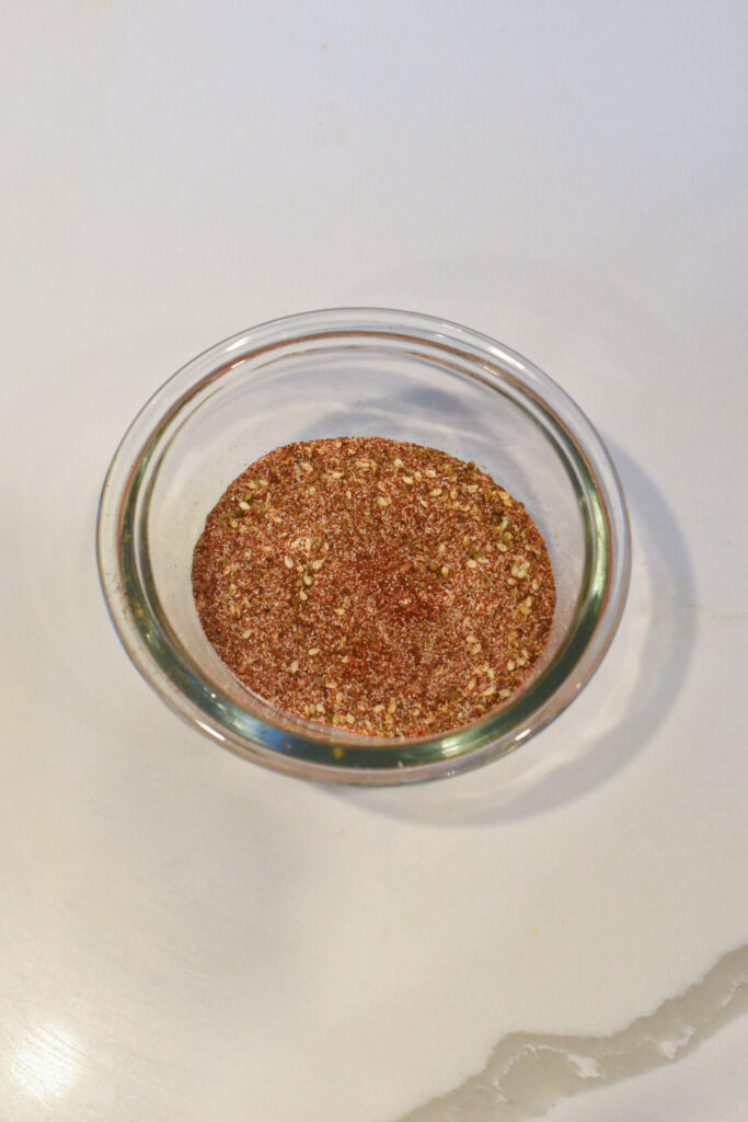 blackened cod seasoning A glass bowl filled with blackened cod seasonoing.