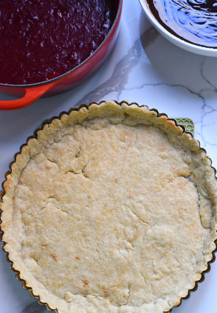 A baked tart crust ready for filling.